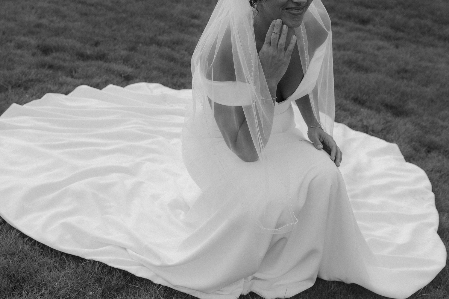 A flowing white wedding dress billows in the wind as it's photographed across multiple artistic black and white frames.