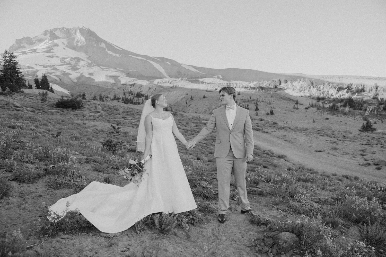 Scenic mountain wedding photography session with dramatic landscape views.