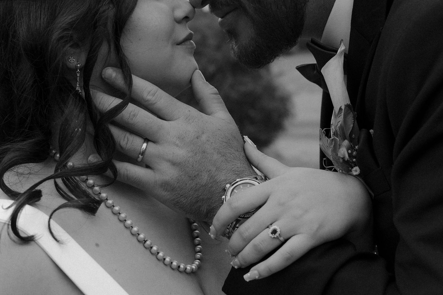 A series of romantic black and white photographs showing close-up intimate moments between a couple.