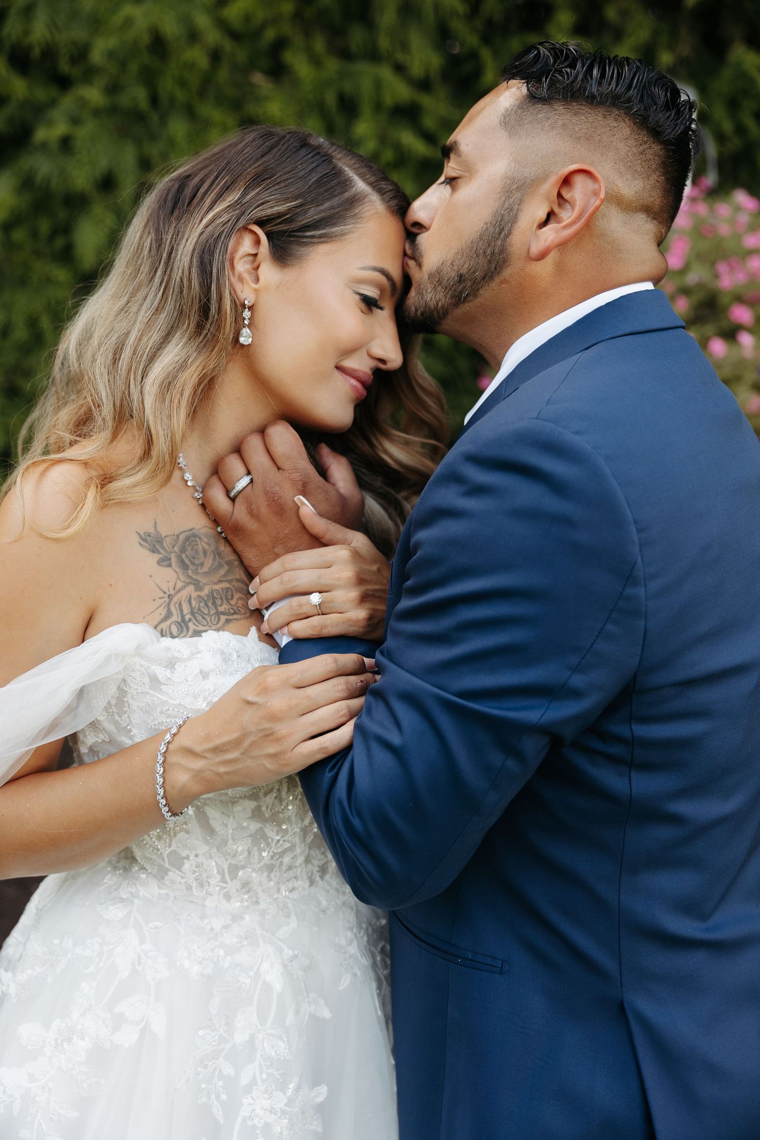 A romantic wedding photo sequence showing tender moments between newlyweds in navy suit and white lace dress.