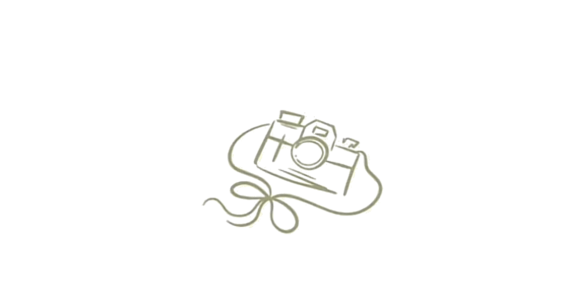 Simple line drawing of a vintage camera with a decorative ribbon bow underneath.