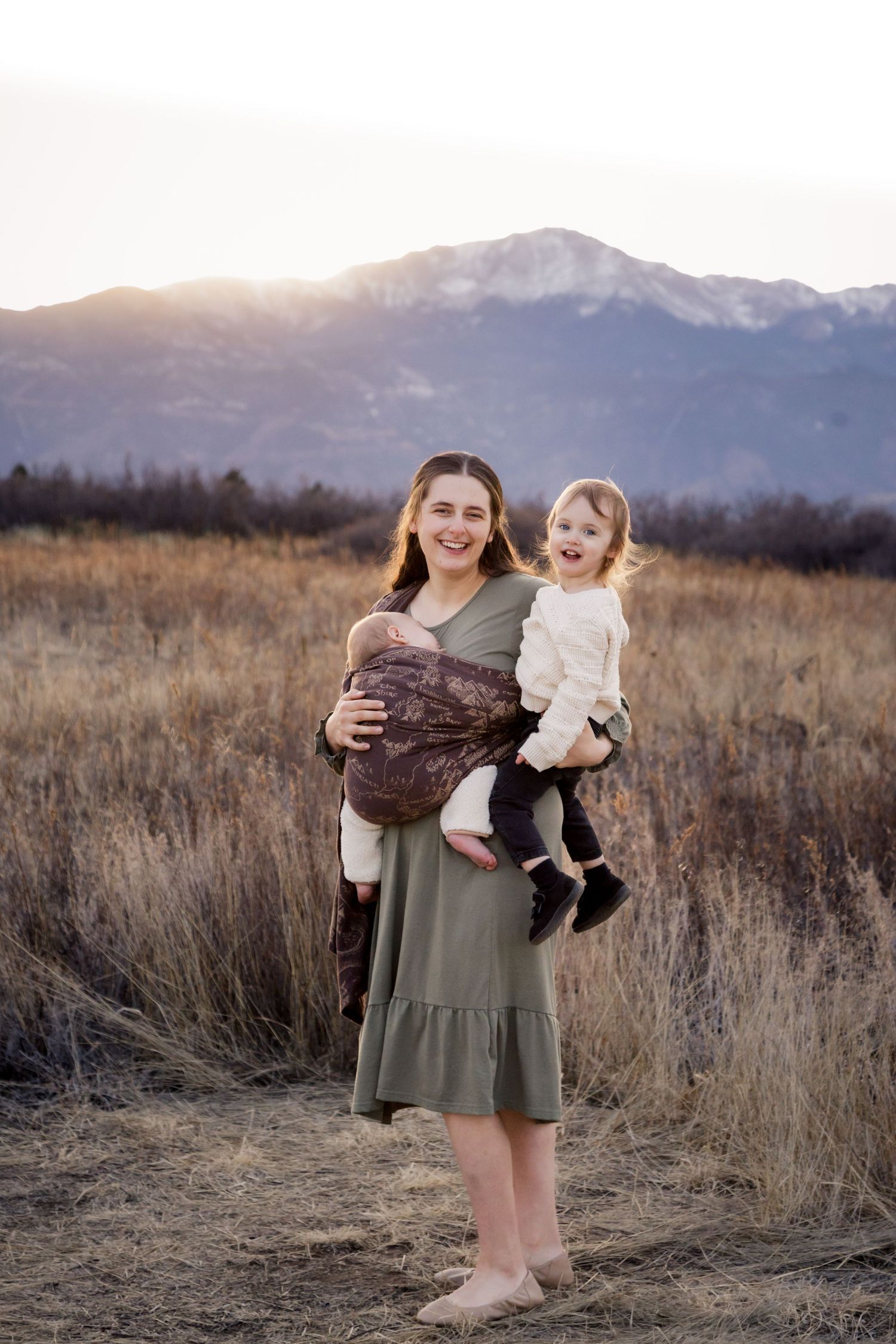 A series of photos in a grassy field with snow-capped mountains in the background during golden hour.
