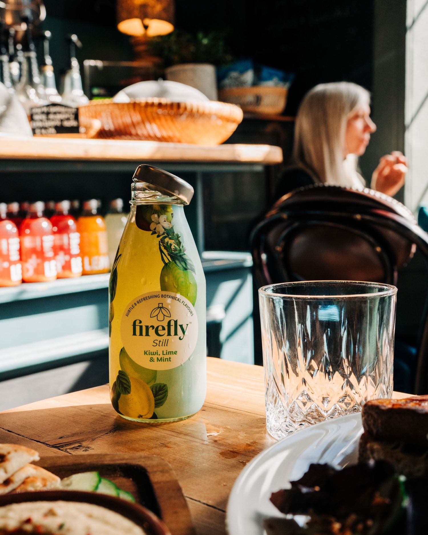 Firefly still kiwi lime & mint drink photographed in a cafe for lifestyle photography