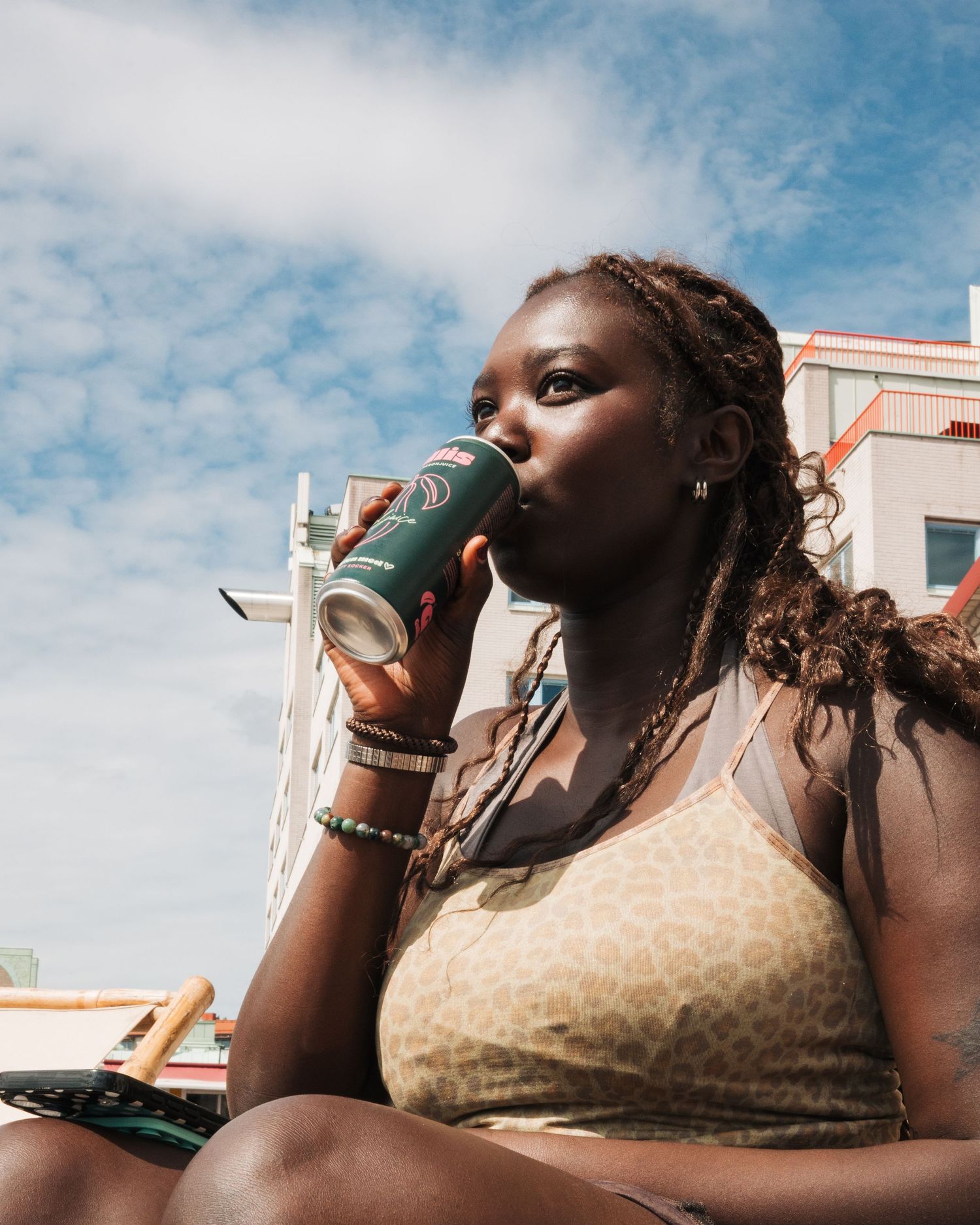 woman drinking Gullis pear drink at an event in Stockholm, Sweden. commercial event photography for brands