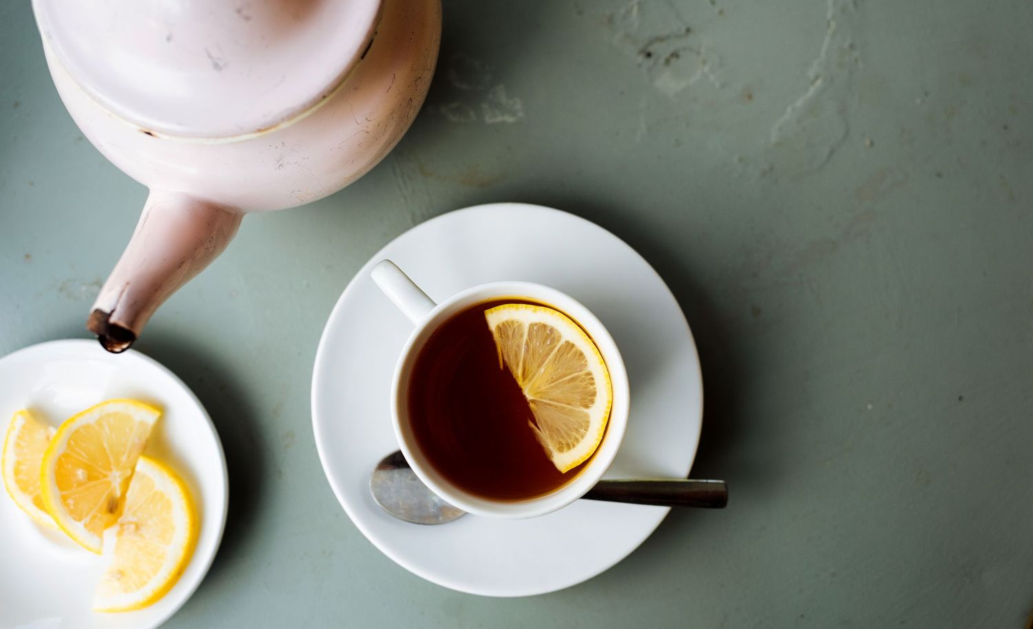 cup of black tea with lemon in a cup and saucer for commercial lifestyle photography in Stockholm