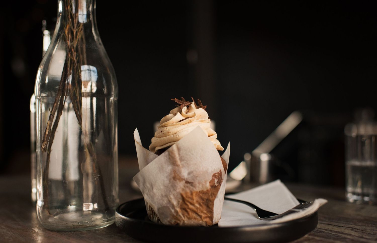 chocolate cupcake on a table in a cafe commercial lifestyle photography