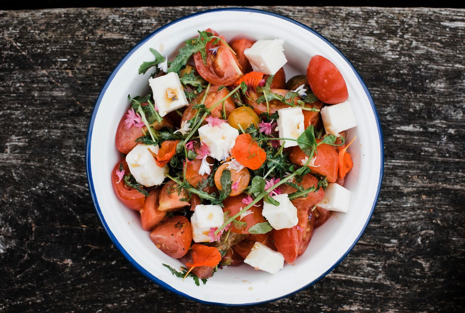 colourful tomato and feta salad photographed for a restaurant lifestyle shoot in Stockholm
