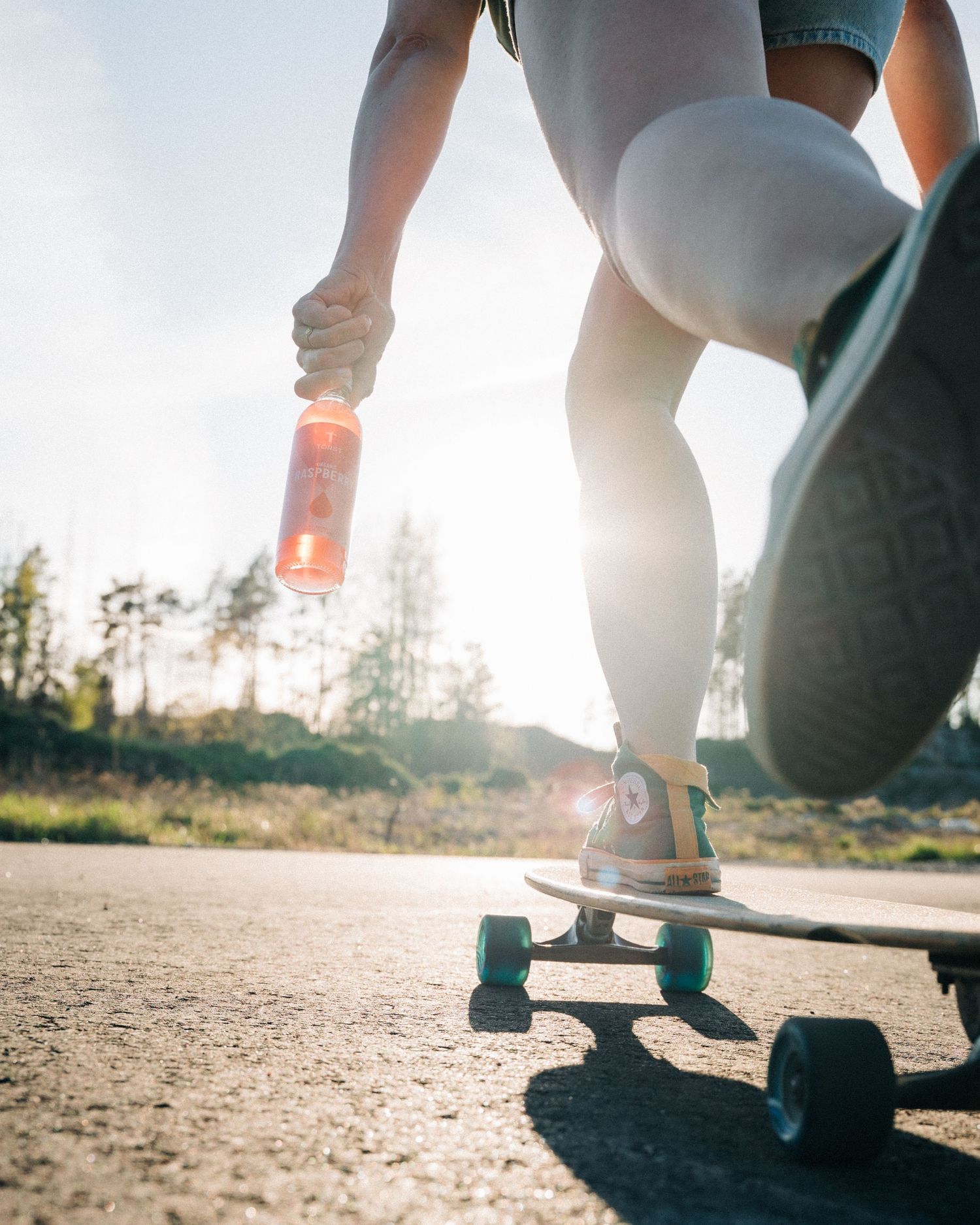 woman skating on a skateboard for a commercial shoot for Törst organic beverages in Stockholm