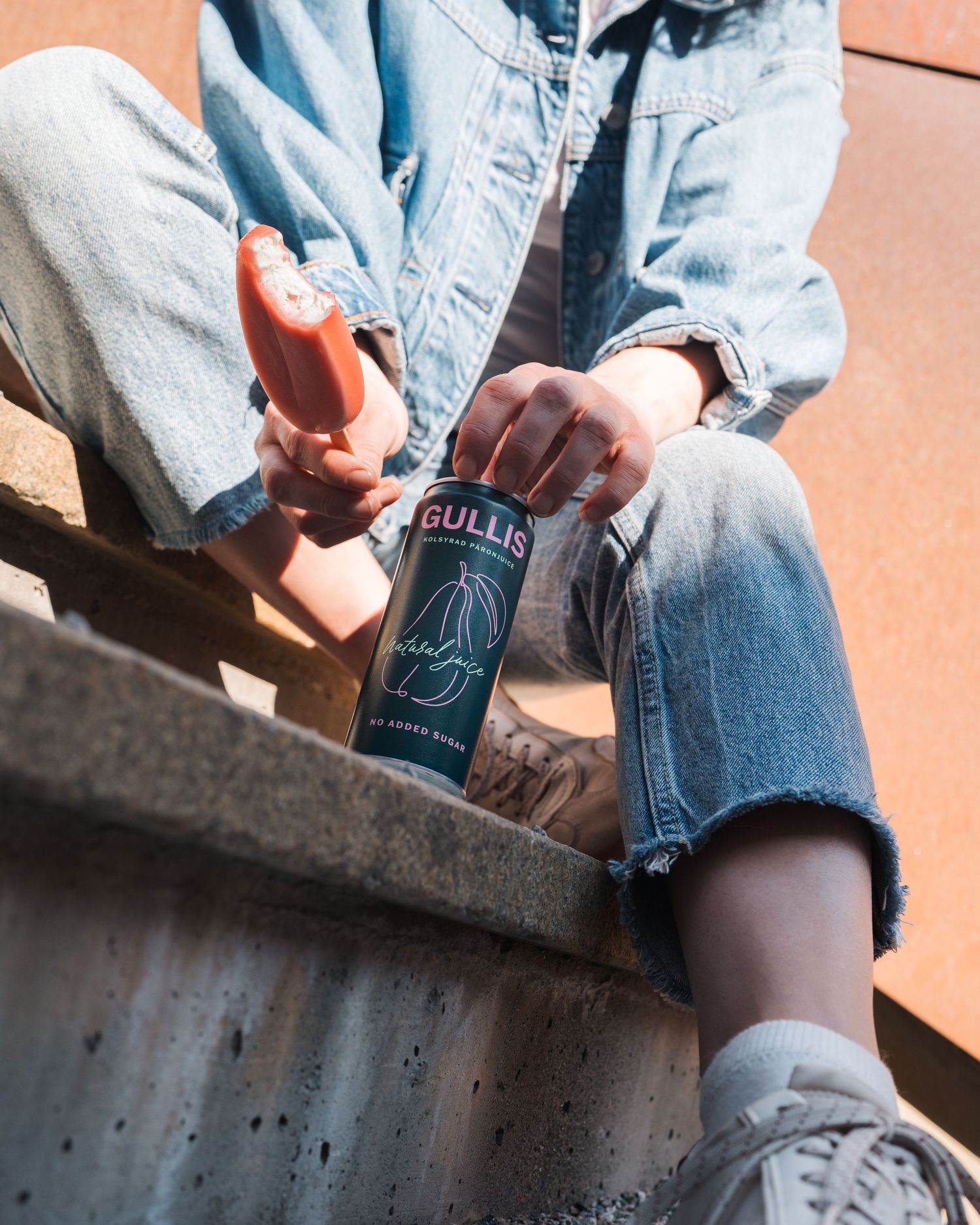 Lifestyle Image shot for Gullis beverage brand product photography. Woman holding the drink and ice cream