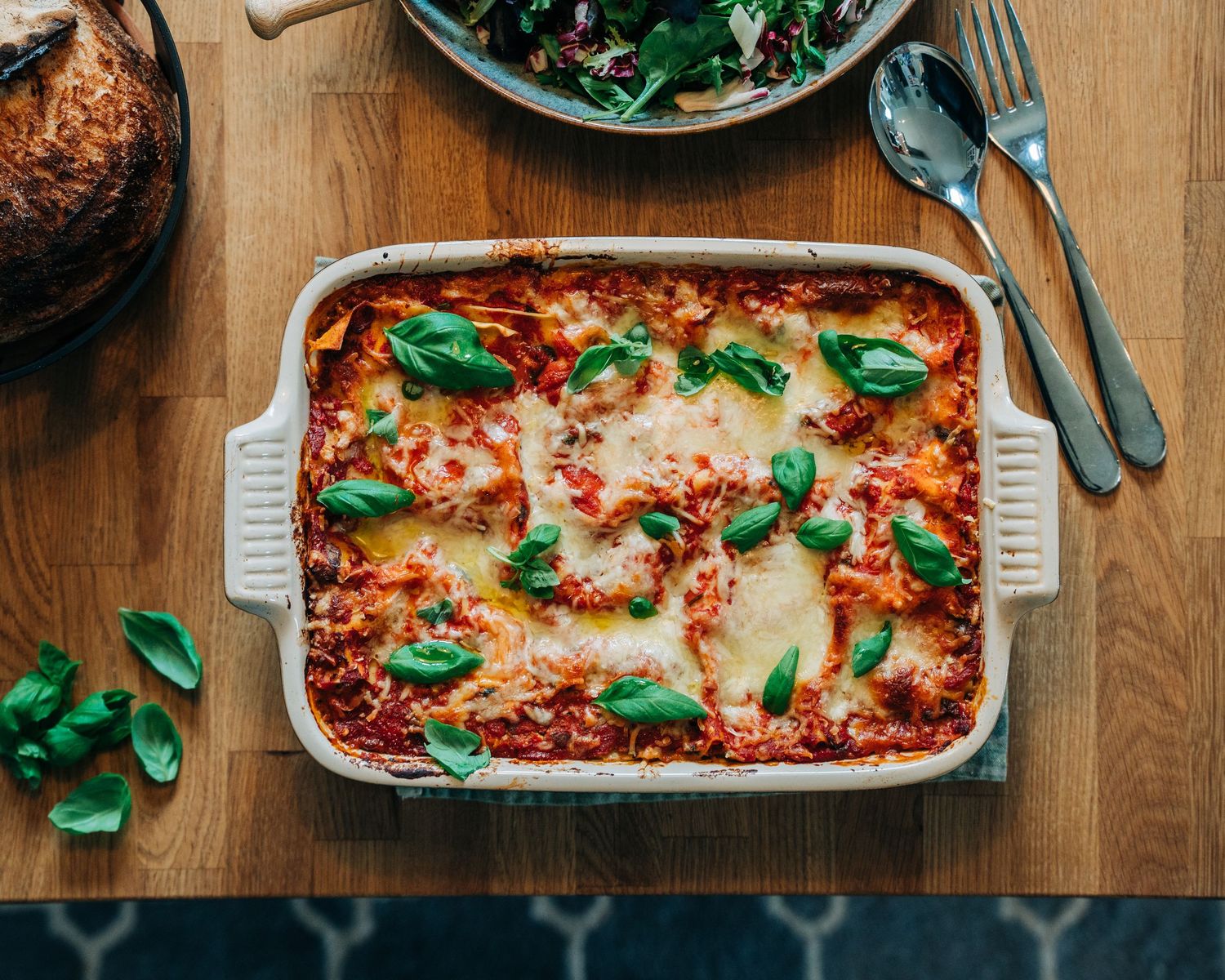homemade lasagna on a kitchen table for a commercial branding cookbook shoot in Stockholm, Sweden