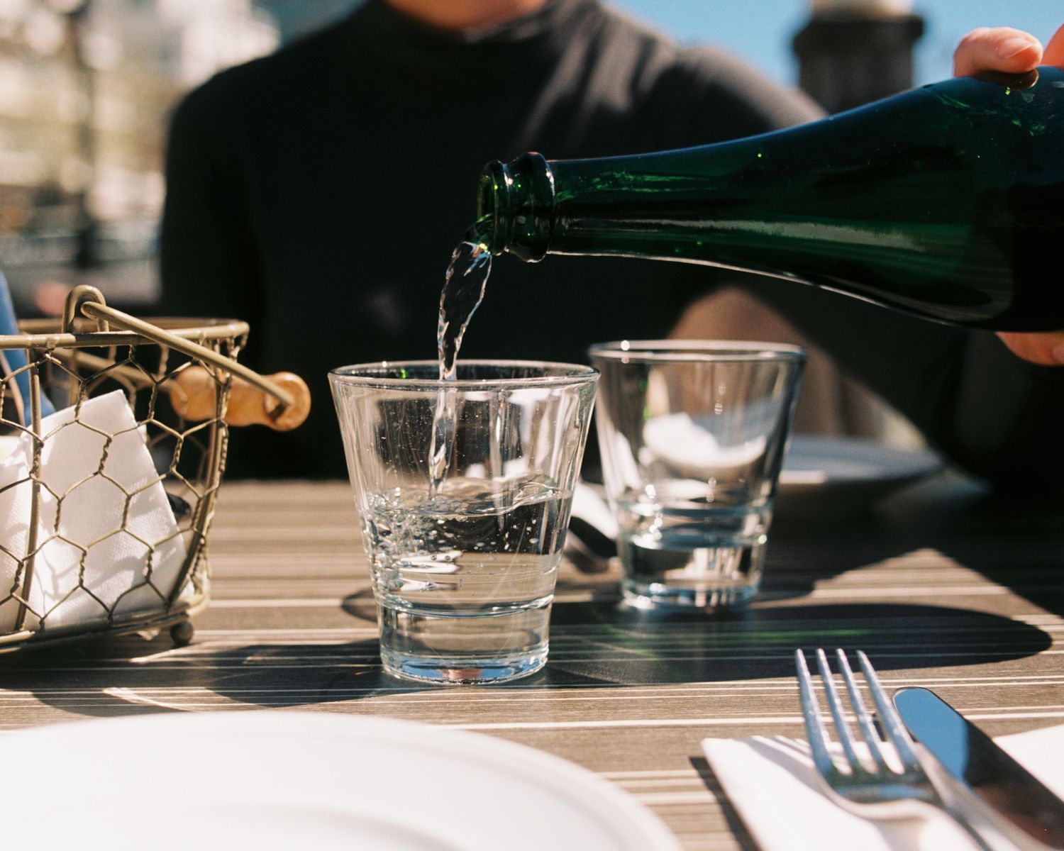 water being poured at a restaurant commercial film analogue photography studio in Stockholm.
