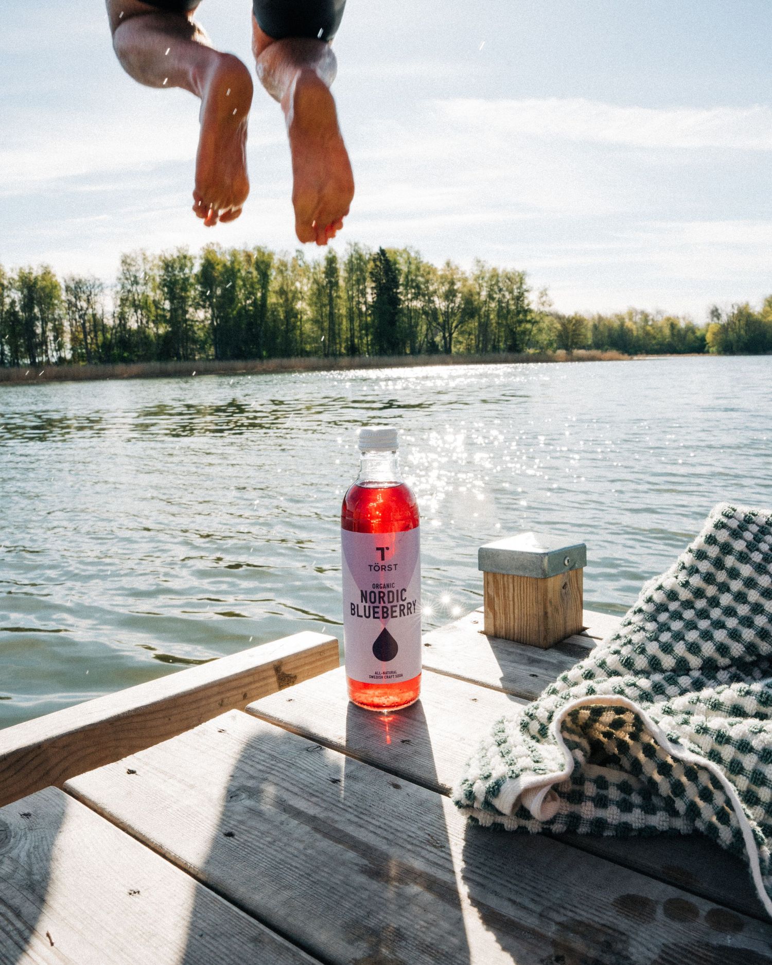 lifestyle commercial photoshoot for Törst organic drinks at Norrtälje floating sauna in Sweden