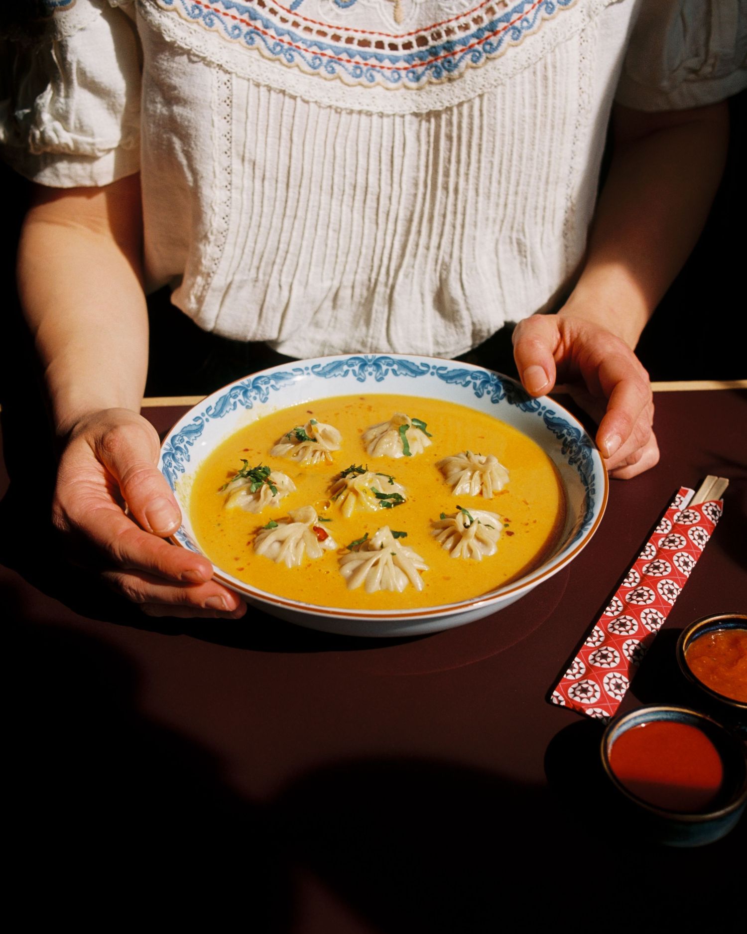bowl of dumplings photographed in a restaurant in Stockholm shot on film, analogue photographer Sweden. mat och dryk