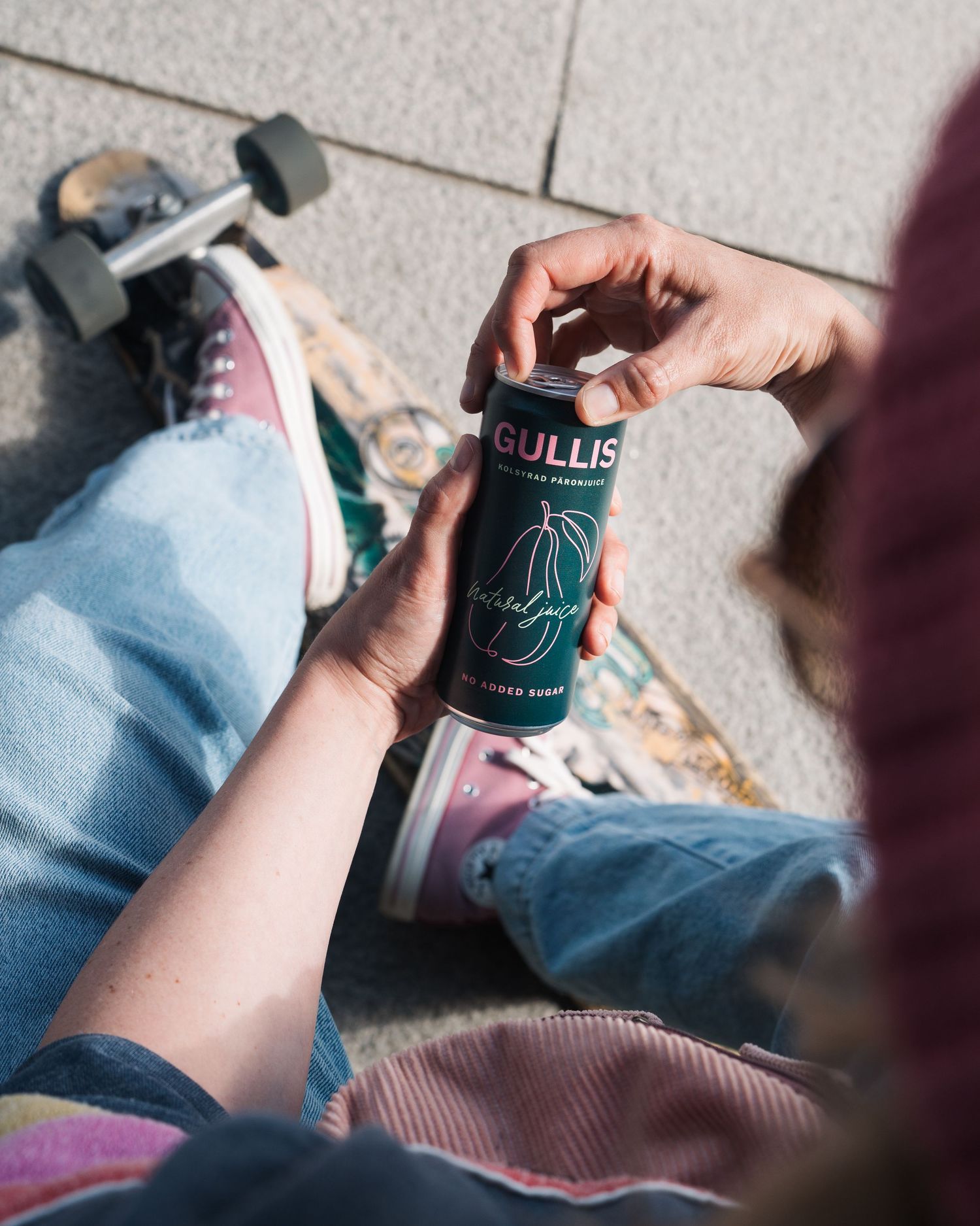 lifestyle product images for Gullis drinks brand in Stockholm. Woman holding a drink whilst skateboarding
