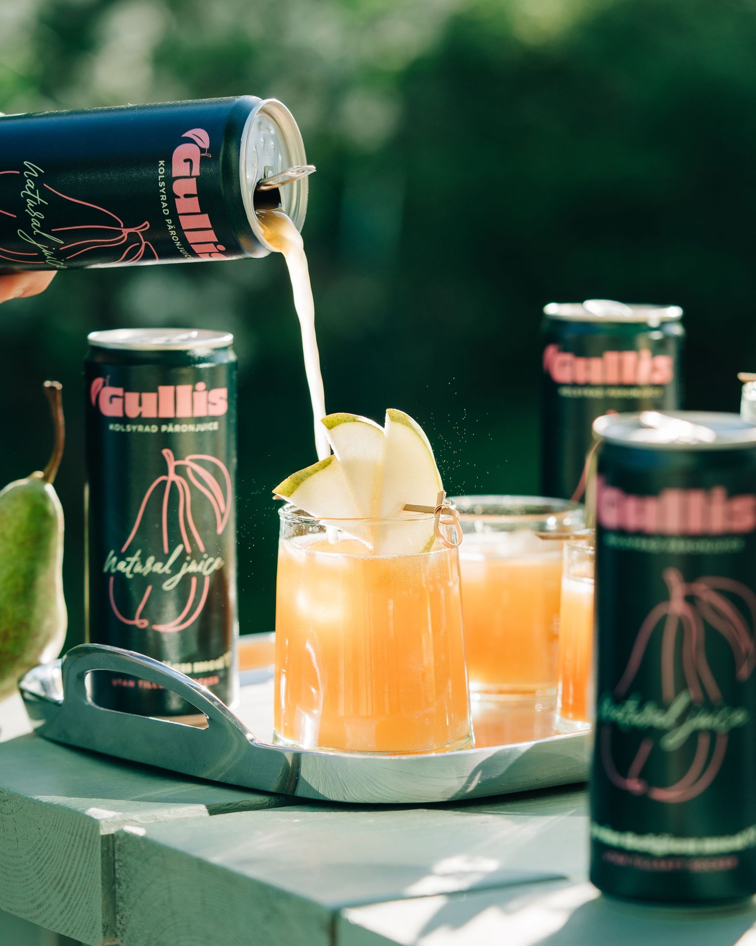Gullis craft pear juice. A content creation commercial photography shoot in a Swedish garden
