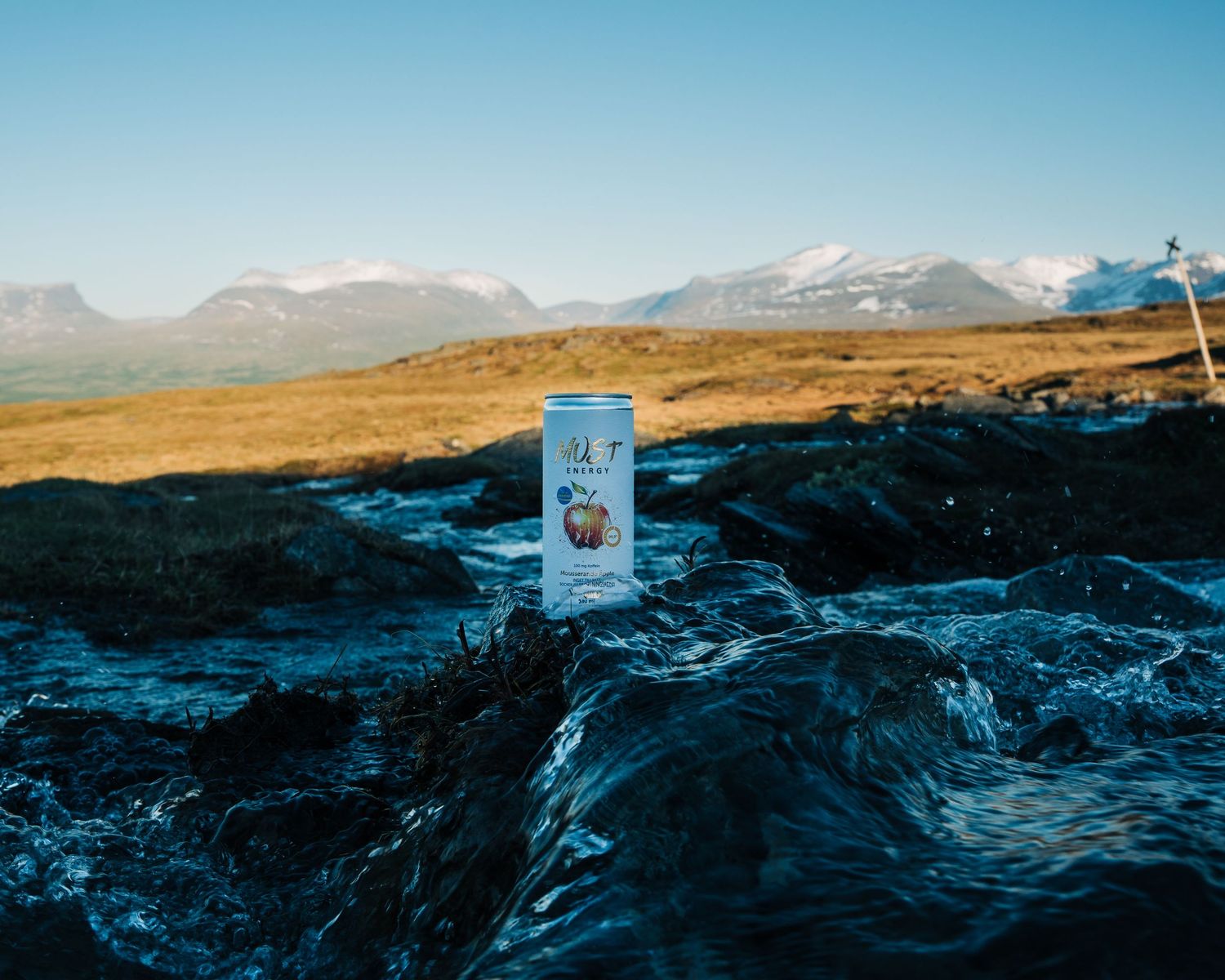 Must Energry photographed in the water at Abisko National Park under the midnight sun in Sweden