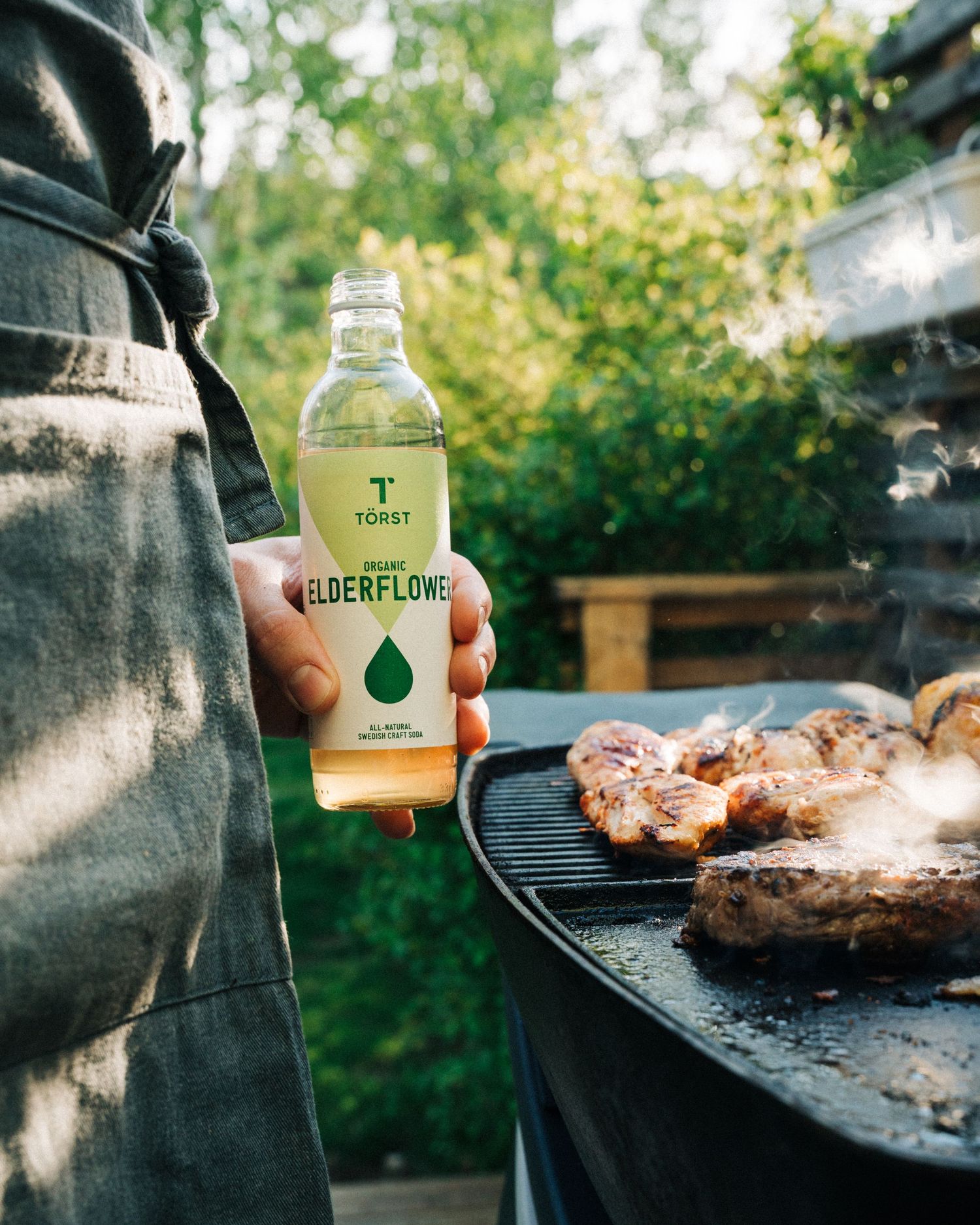 Elderflower Törst organic drink photographed having a BBQ in summer for a commercial food photography