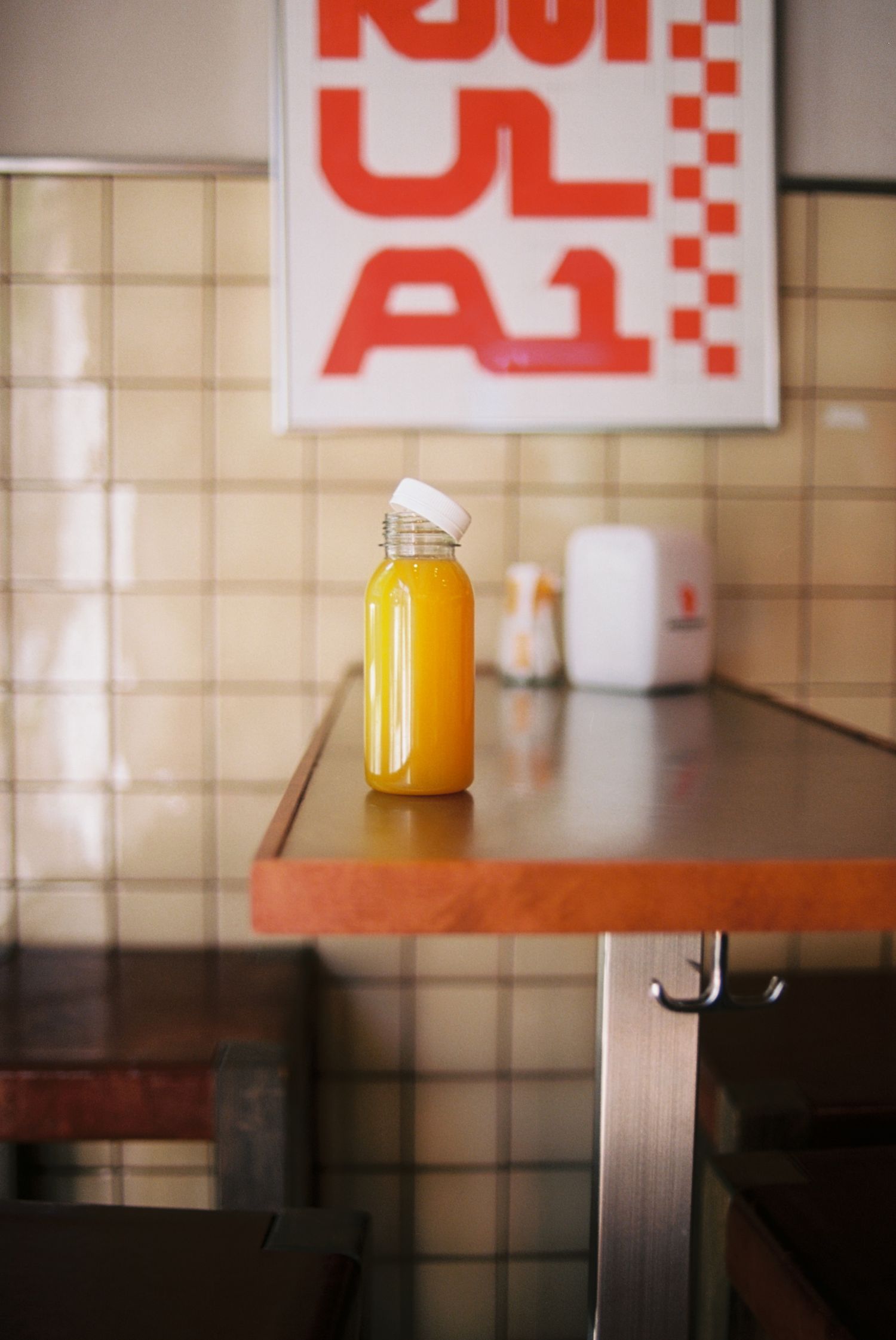 Olli deli Stockholm, fresh orange juice photographed on film, analogue content creator Stockholm
