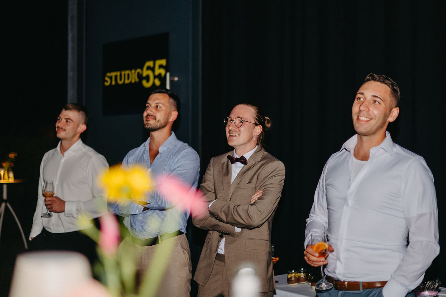 A series of candid photos showing people socializing and mingling at what appears to be a networking event or party.