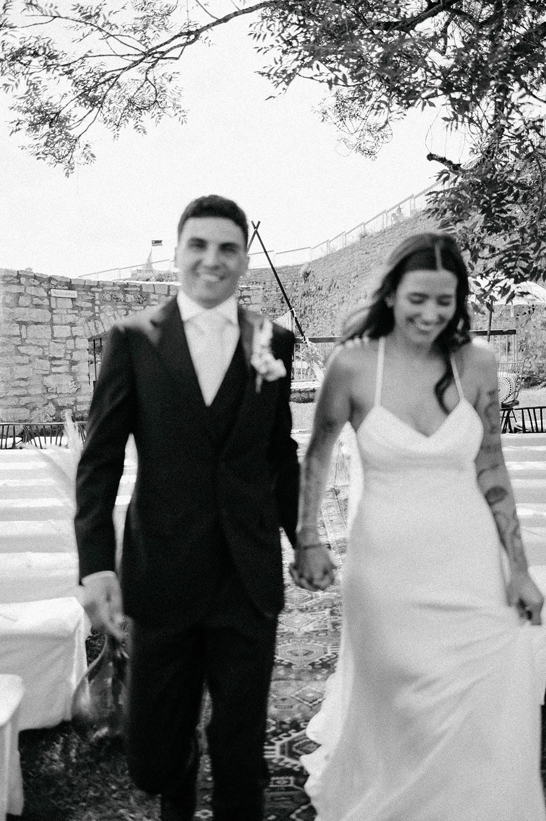 A series of black and white wedding photos showing a couple outdoors under trees in formal attire.