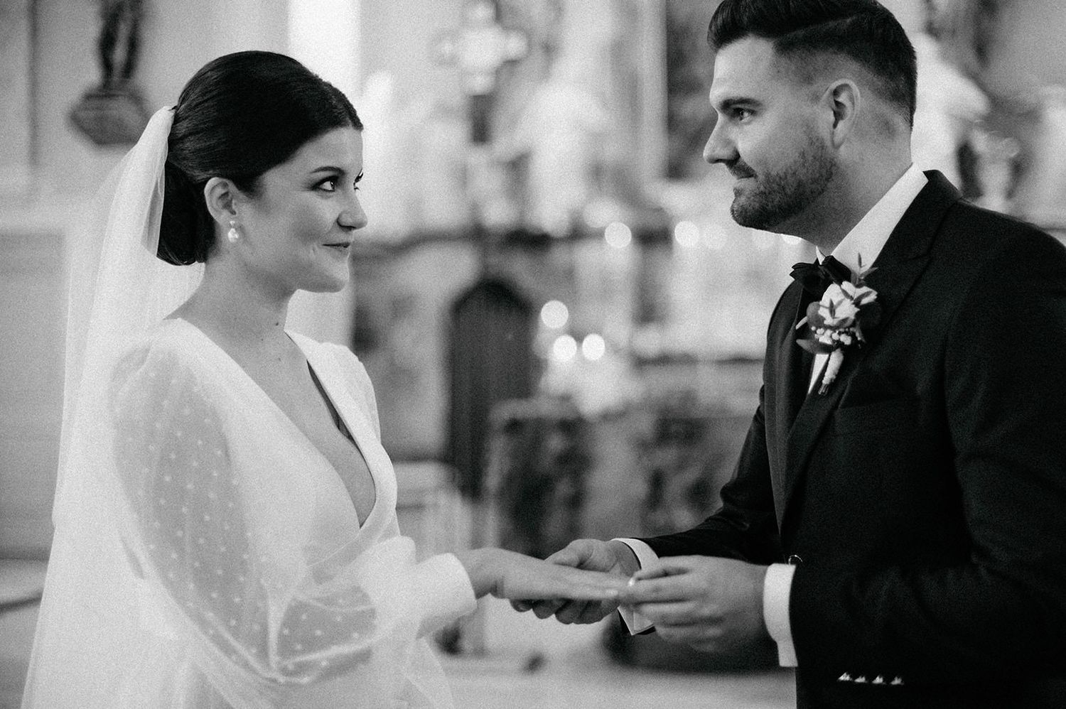 A series of black and white wedding photos showing intimate moments between a bride and groom during their ceremony.