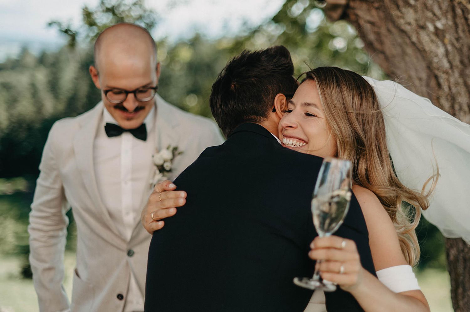 Romantic wedding moments captured in a series of candid photographs showing couples embracing and celebrating.