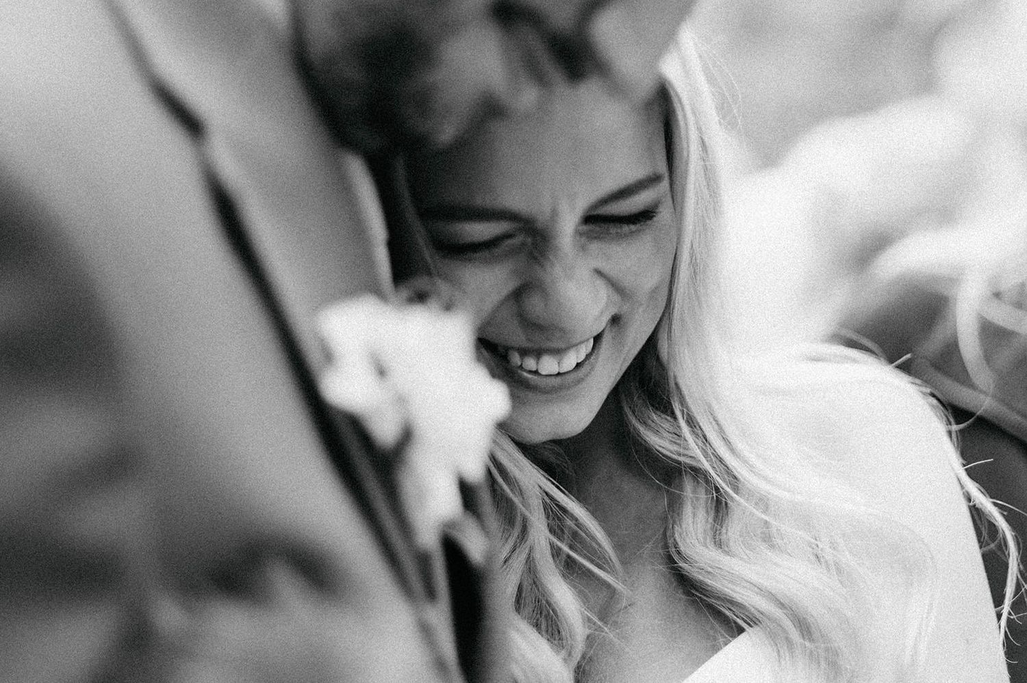 Black and white wedding photos showing intimate moments between a couple on their special day.
