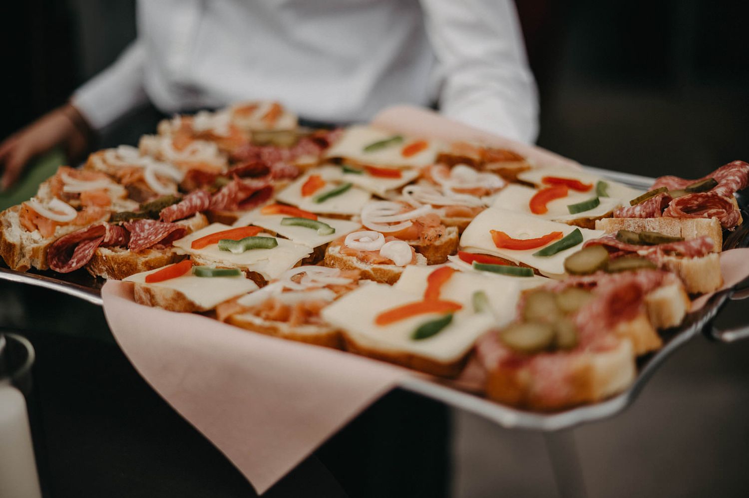A freshly baked pizza topped with melted mozzarella cheese, pepperoni, and red sauce on a metal baking sheet.