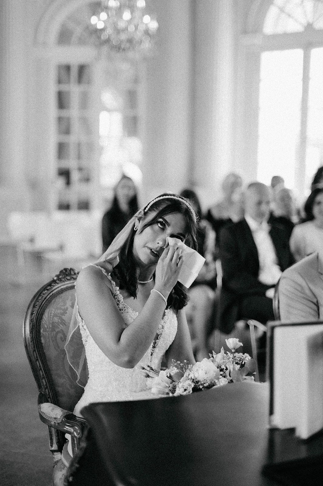 A series of black and white candid photographs showing someone in an elegant dining room leaning back in their chair.