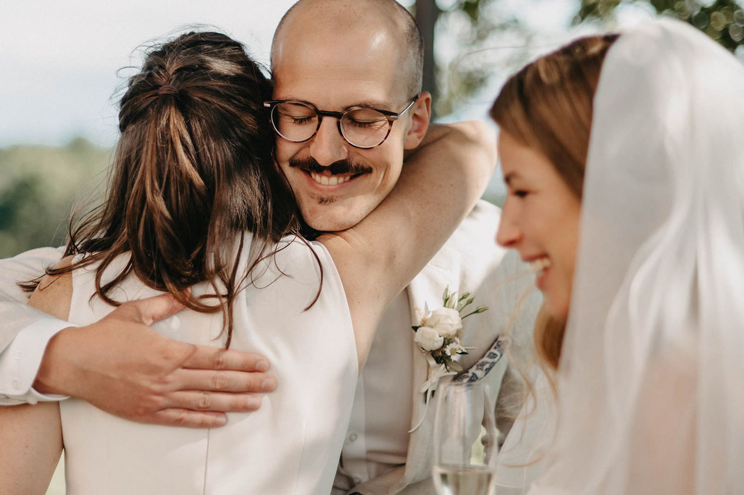A collection of candid wedding moments showing couples embracing and sharing intimate moments during a celebration.