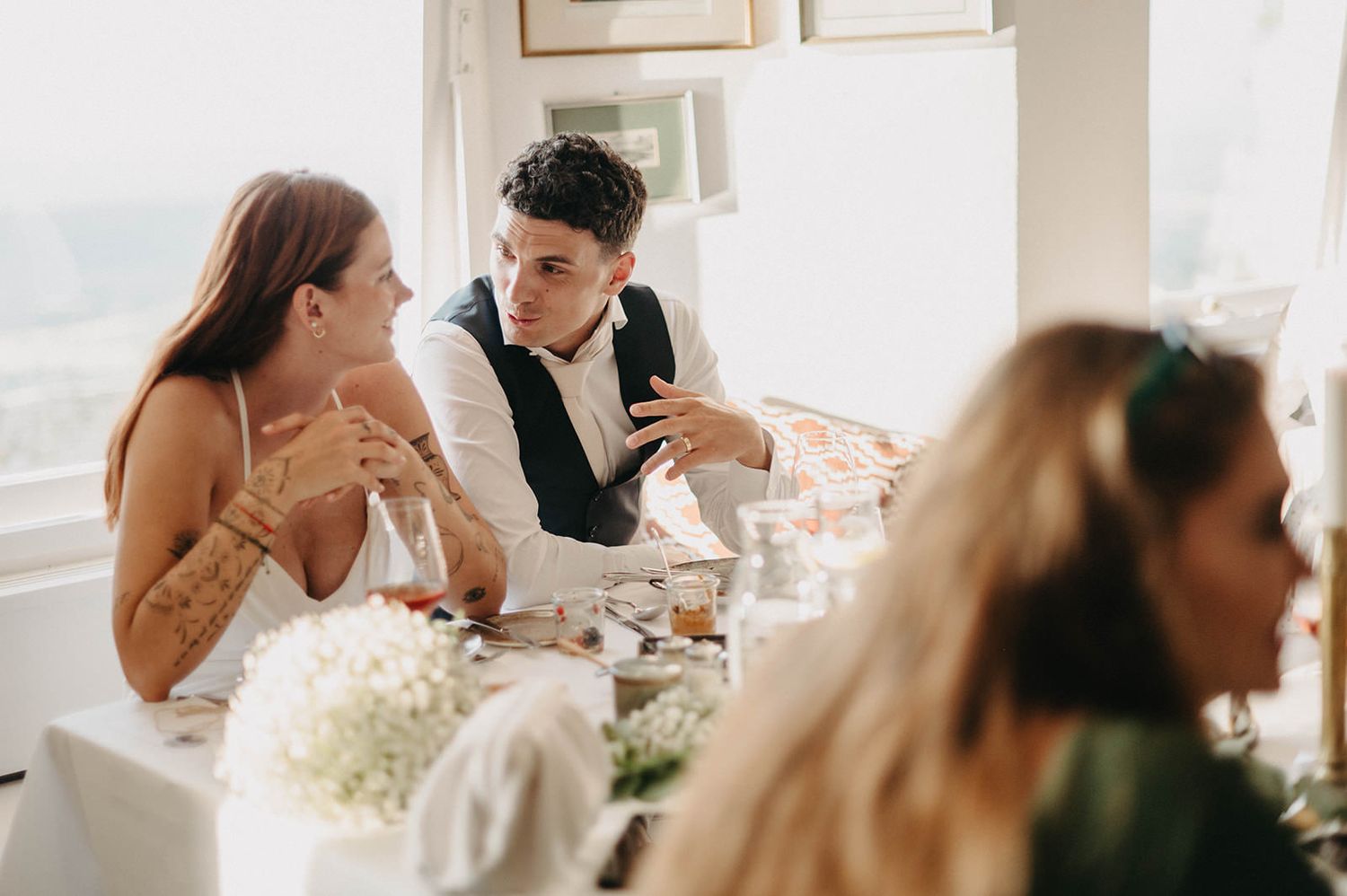 A romantic wedding couple shares intimate moments in a series of candid photos with soft natural lighting.