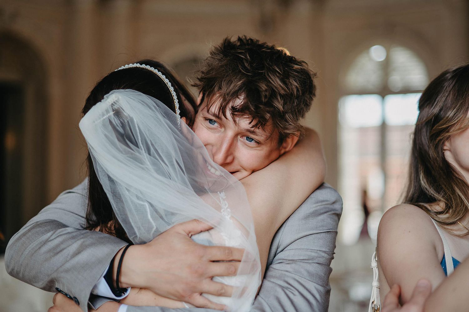 A romantic wedding photo series showing intimate moments between newlyweds in black and white.