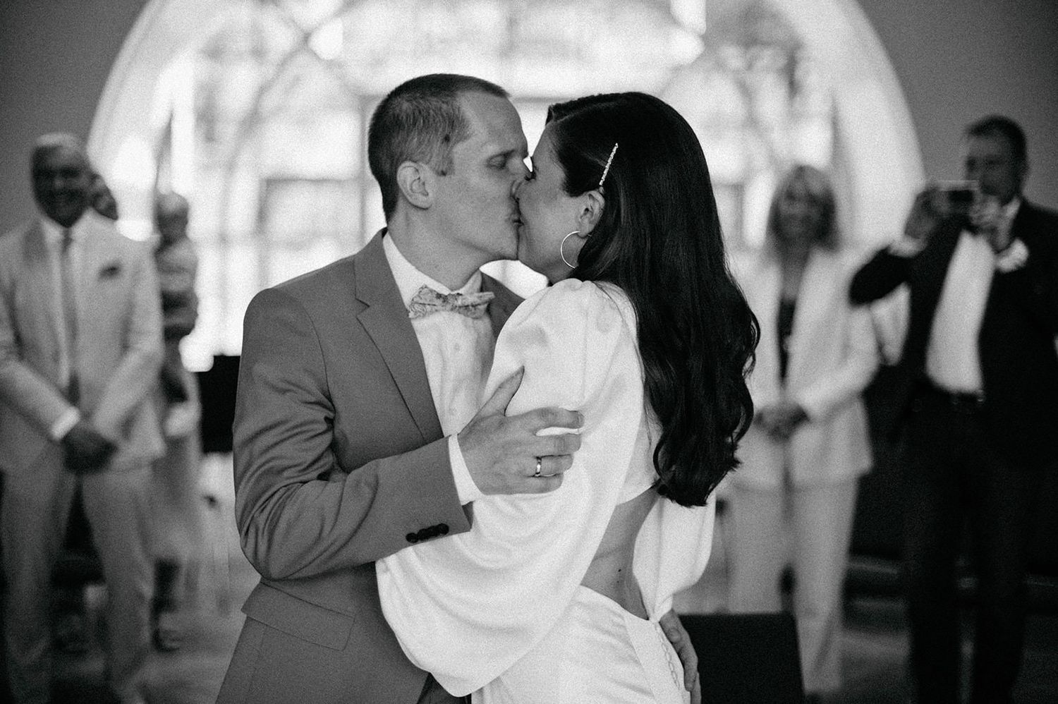 A series of black and white wedding photos capturing intimate dance moments between newlyweds.