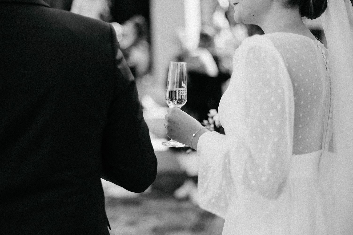 Black and white wedding photo collage showing intimate moments between a bride and groom during their special day.