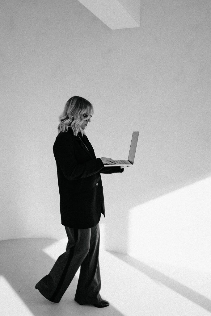 Artistic black and white portraits showing movement in a minimalist space.
