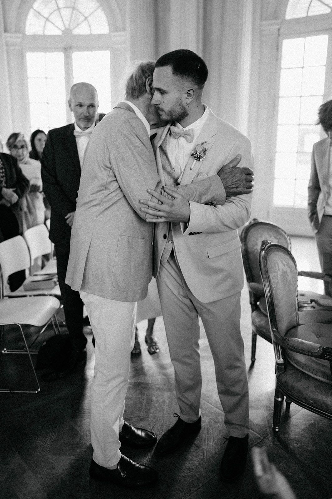 Black and white photo series showing dance partners practicing close embrace movements in a bright studio space.