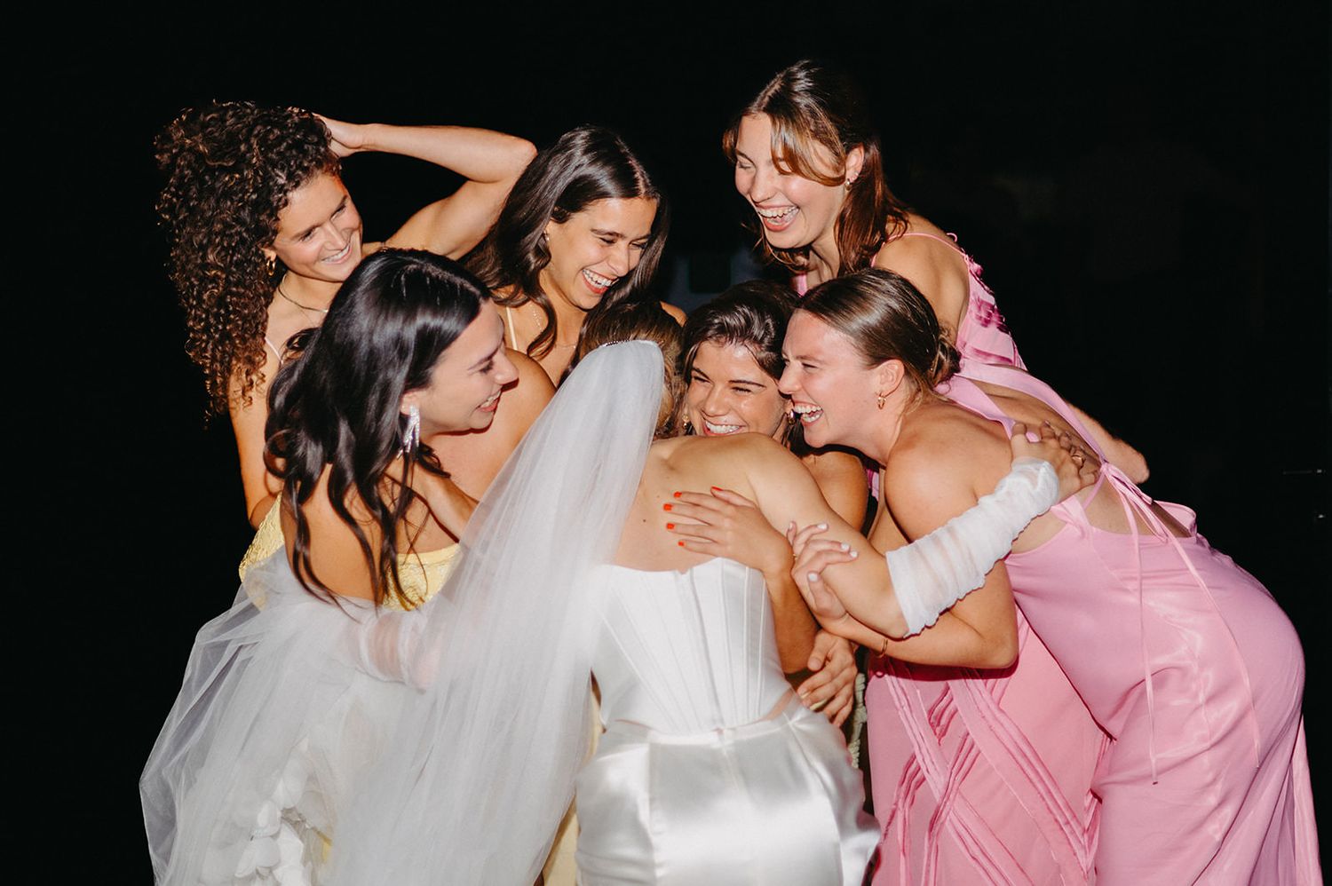 A series of six similar photos showing people in white and pink dresses posing together at a special event.