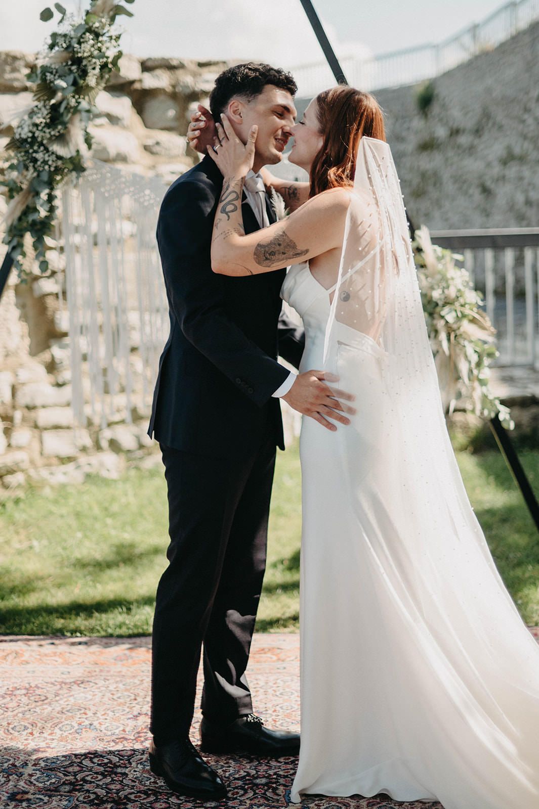 A romantic wedding photoshoot sequence showing tender moments between a couple in a garden setting.