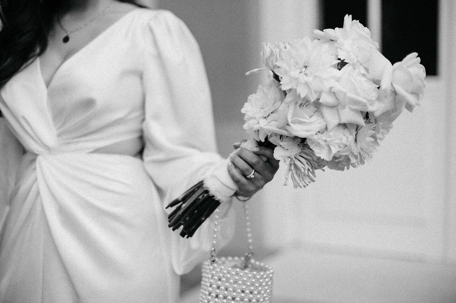 A series of black and white wedding photos showing couples in romantic poses and elegant wedding attire.