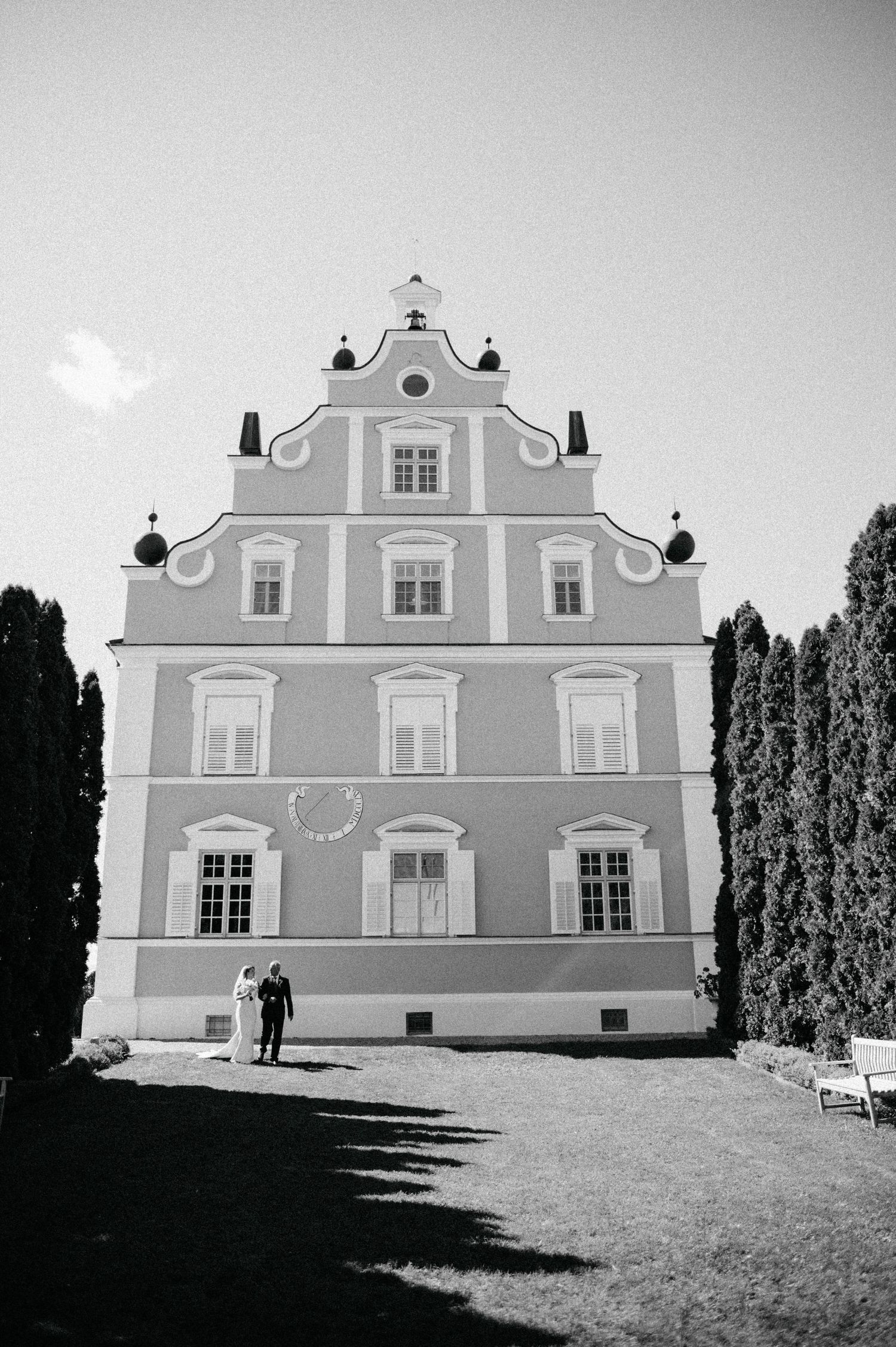 Black and white architectural shots of a baroque-style building with ornate facade.