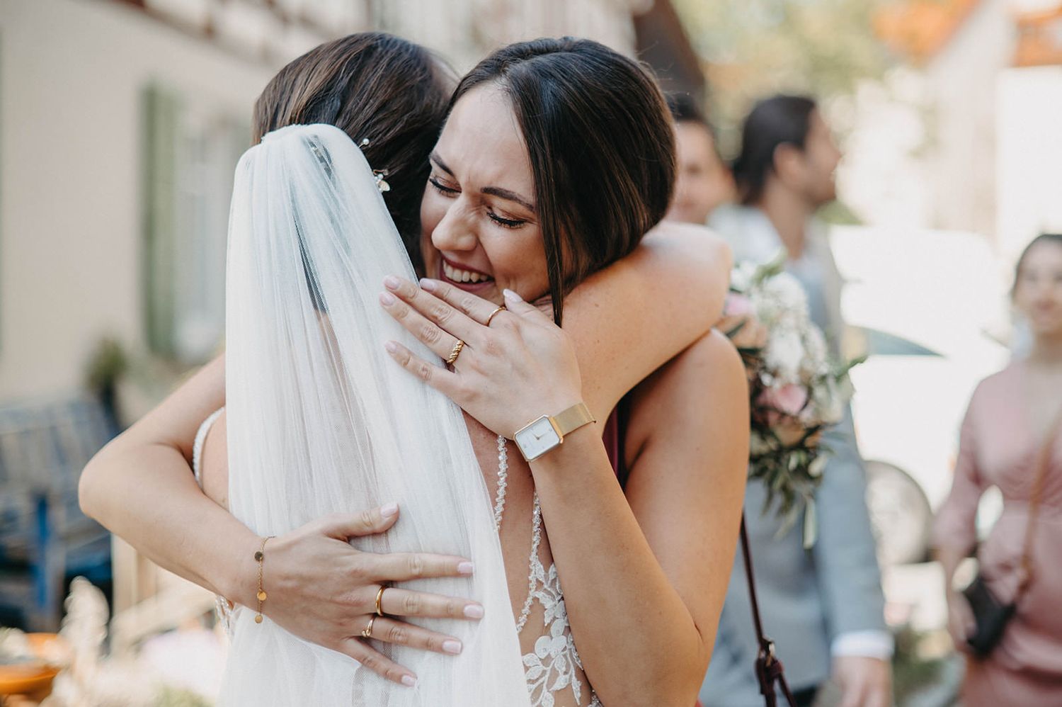 Bride and groom share tender embraces in a series of emotional wedding day moments.