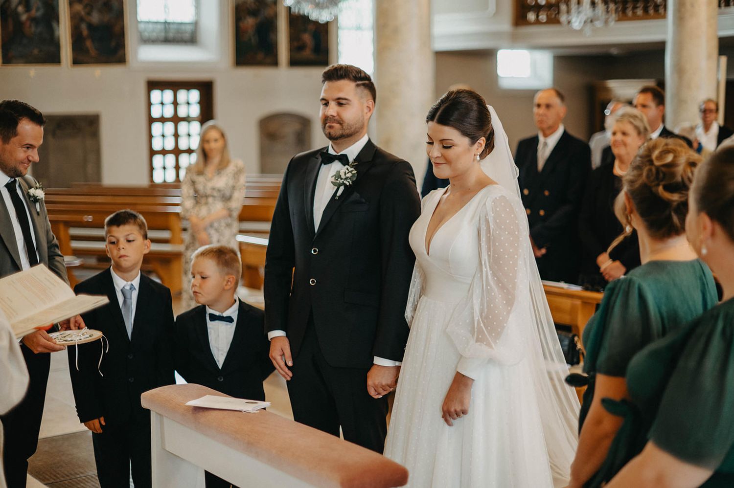 A collection of wedding ceremony moments showing guests and the couple in a traditional church setting.