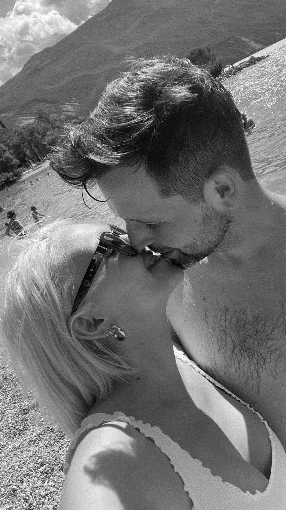 Black and white beach portraits showing intimate close-up moments.