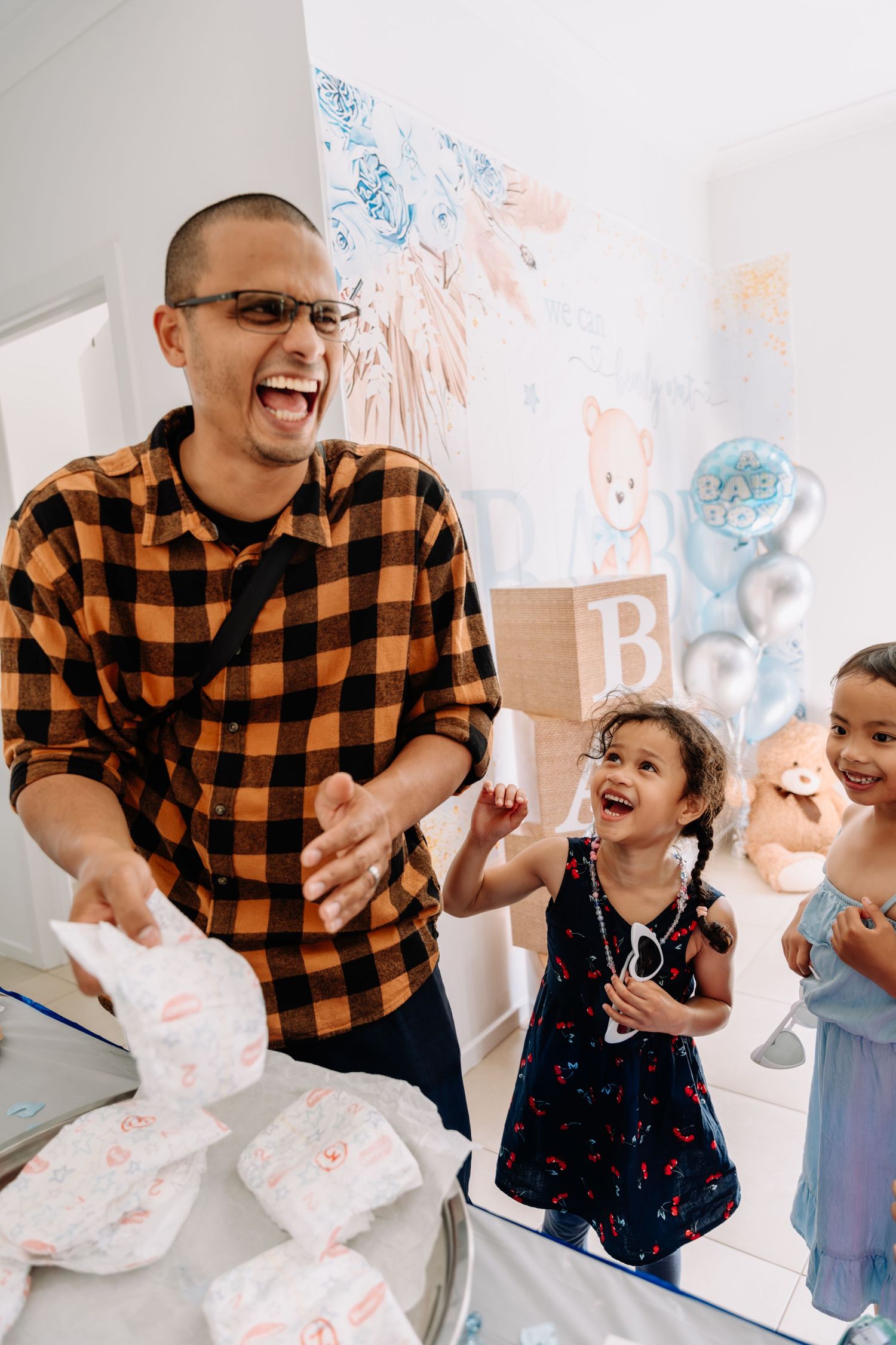 Happy celebration with confetti and laughter in a decorated room.