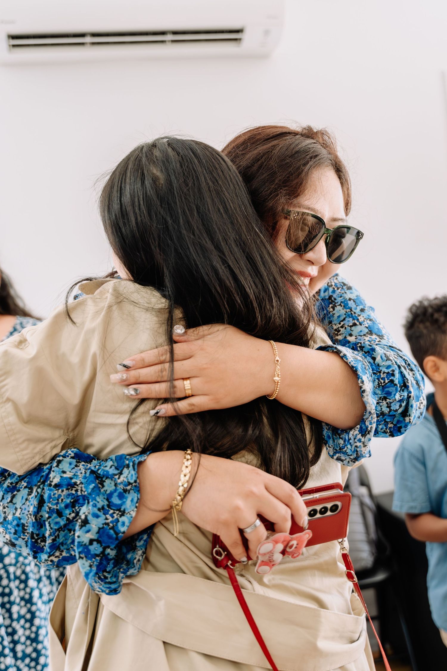 A series of emotional embraces showing two people hugging in a heartfelt moment.
