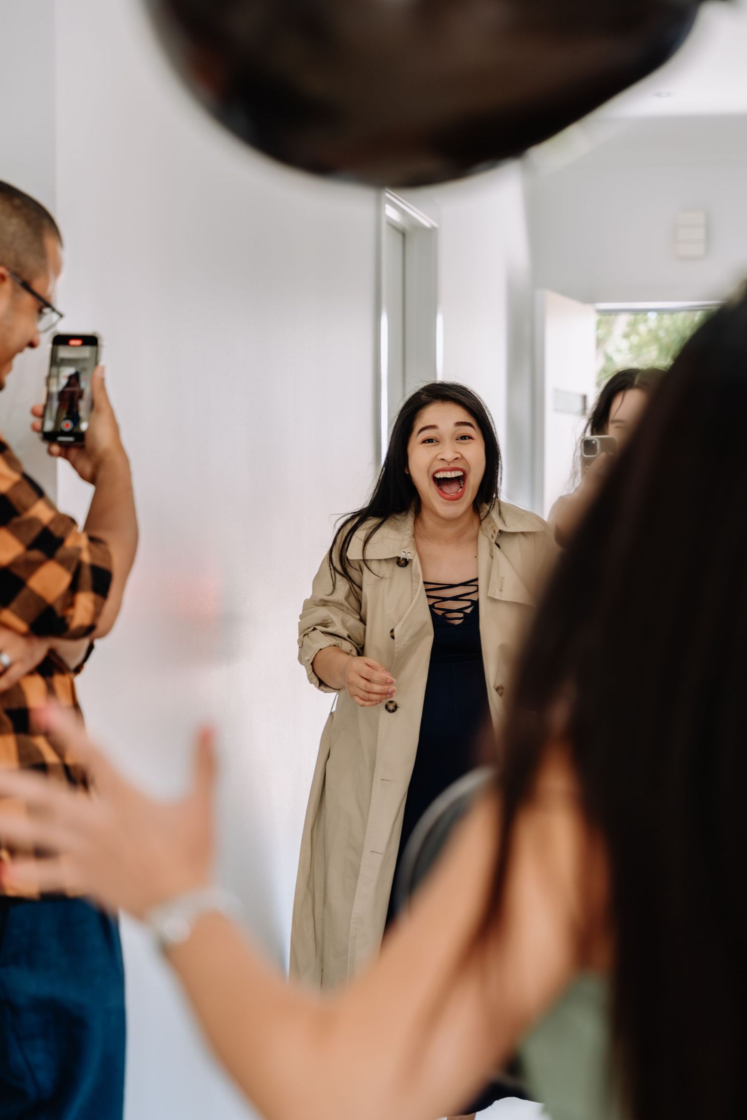 A joyful celebration moment captured in a bright indoor setting.