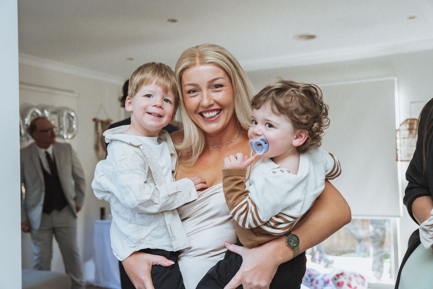 A joyful family moment captured in a series of candid photos showing playful interactions in a bright indoor setting.