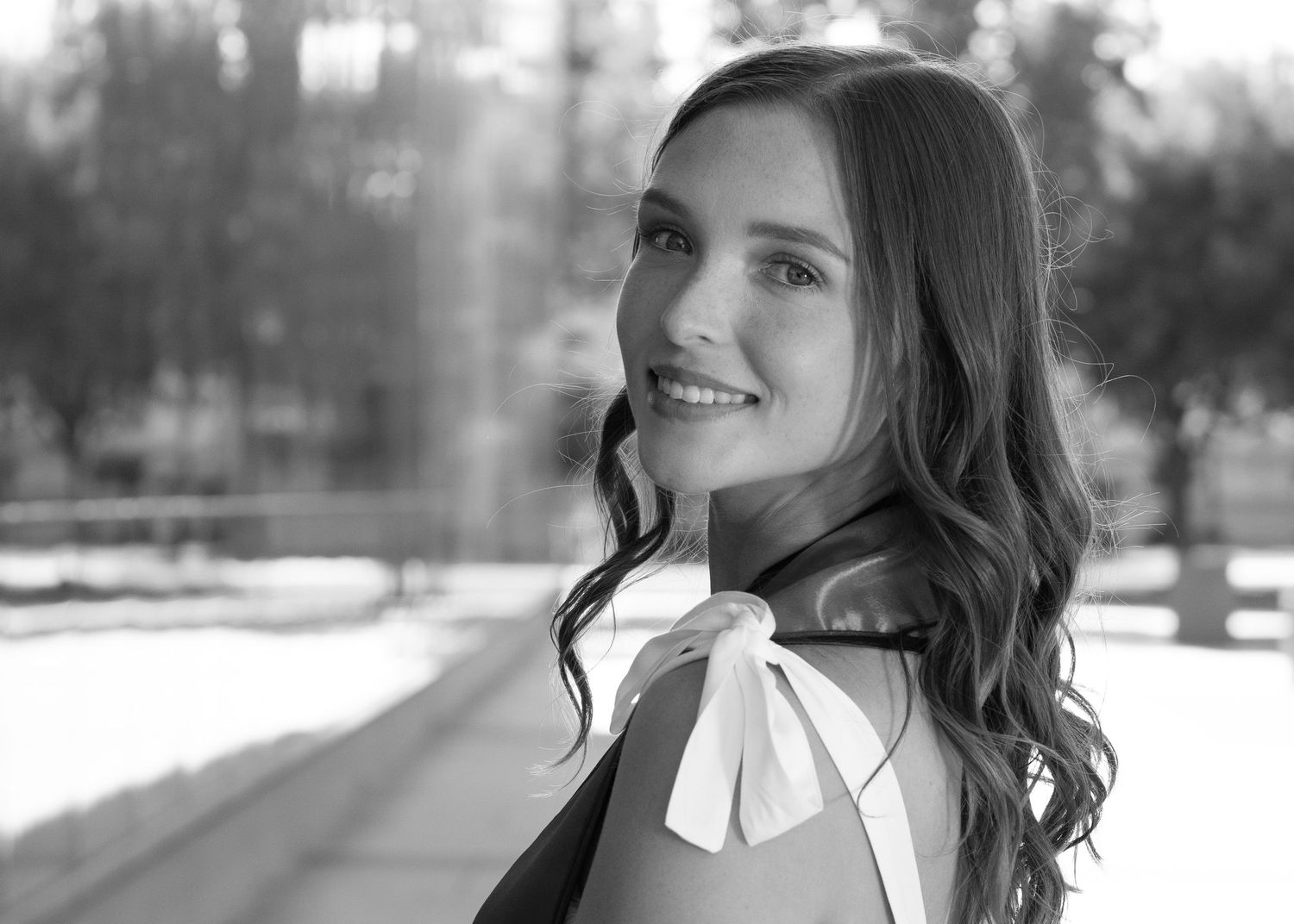 Black and white editorial portrait photographed during golden hour