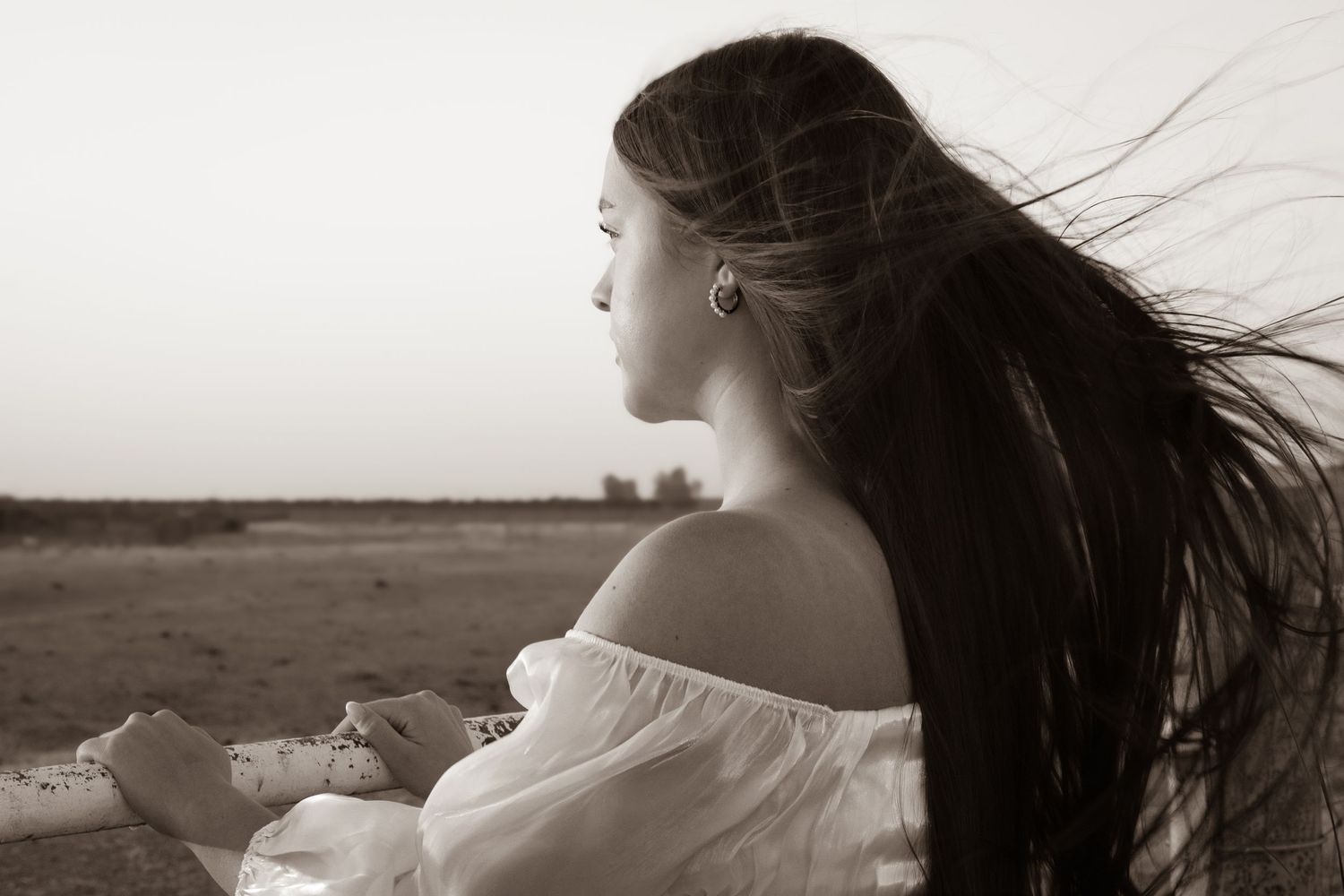 Dramatic portrait style with wind during golden hour in Fresno