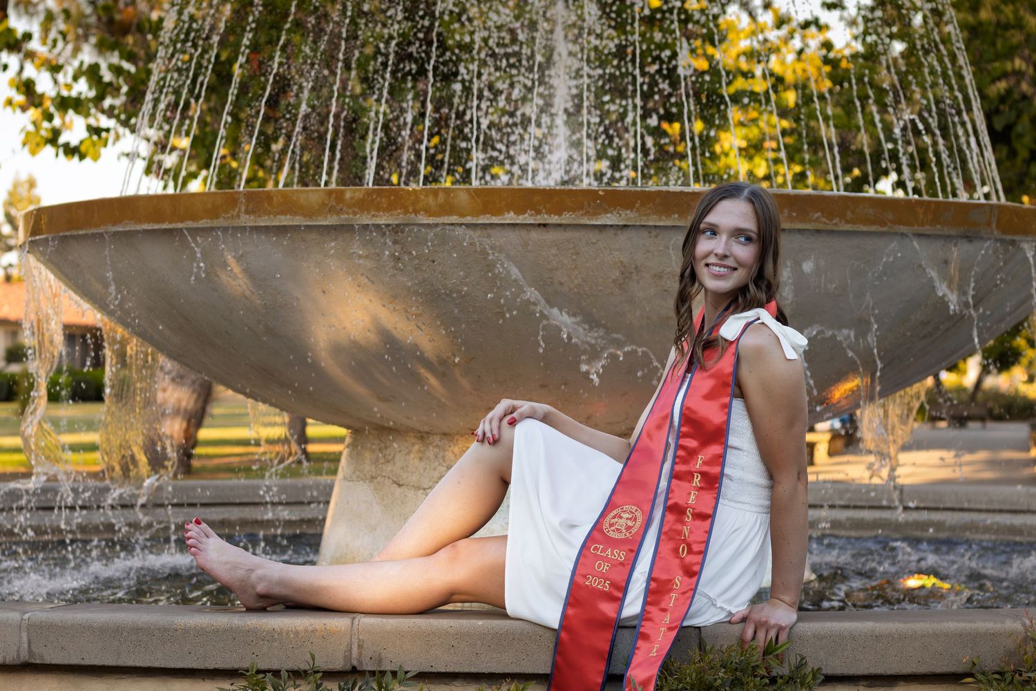 Graduate portrait photographed during golden hour with warm light